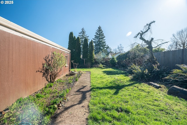 view of yard with a fenced backyard