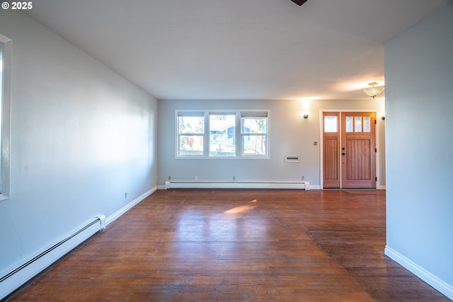 unfurnished living room featuring baseboard heating, dark wood-type flooring, and baseboards