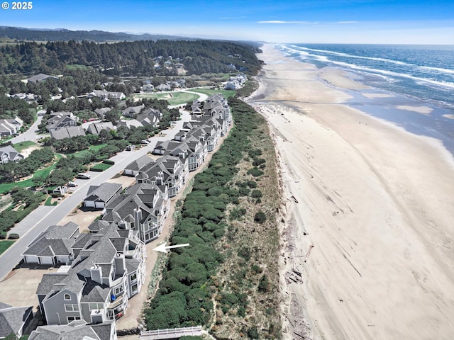 aerial view with a water view and a view of the beach
