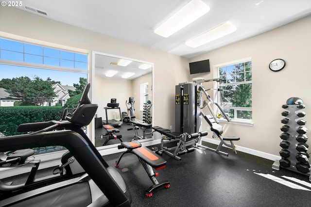 gym with visible vents and baseboards