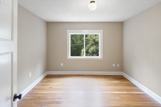 209 NE Fargo St, Portland, OR 97212 - unfurnished room with light wood-type flooring and baseboards
