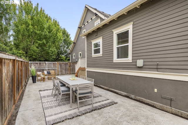 209 NE Fargo St, Portland, OR 97212 - fenced backyard featuring a patio and outdoor dining space