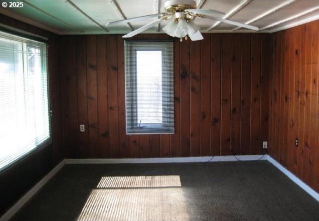 2260 D St, Springfield, OR 97477 - spare room featuring wooden walls and ceiling fan