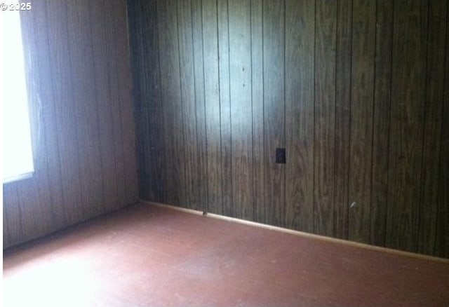2260 D St, Springfield, OR 97477 - empty room featuring carpet flooring and wooden walls