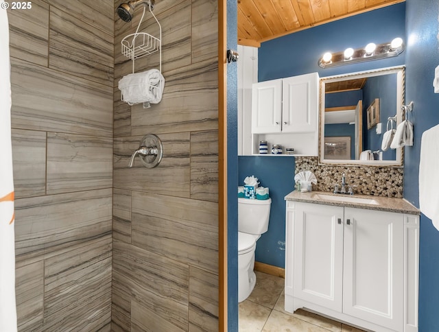 5353 SW Neal Ave, Waldport, OR 97394 - bathroom with tiled shower, vanity, tasteful backsplash, and tile patterned floors