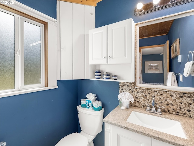 5353 SW Neal Ave, Waldport, OR 97394 - bathroom with backsplash, vanity, and wooden ceiling