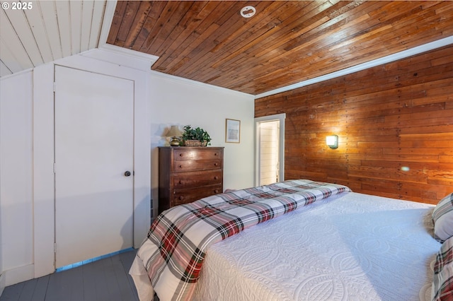 bedroom featuring ornamental molding, lofted ceiling, and wooden ceiling