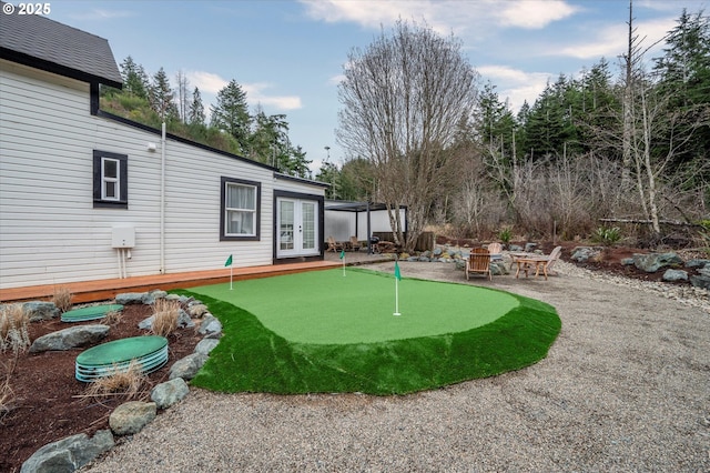 view of yard featuring french doors and a patio