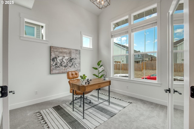 11723 NW Sadie St, Portland, OR 97229 - carpeted office space with baseboards, lofted ceiling, and a chandelier