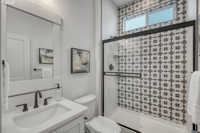 11723 NW Sadie St, Portland, OR 97229 - full bath with vanity, a shower stall, toilet, and backsplash