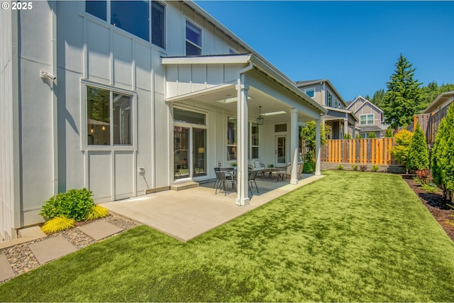 11723 NW Sadie St, Portland, OR 97229 - back of property featuring board and batten siding and a patio