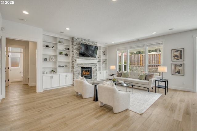 11723 NW Sadie St, Portland, OR 97229 - living room with baseboards, a fireplace, light wood finished floors, recessed lighting, and built in features