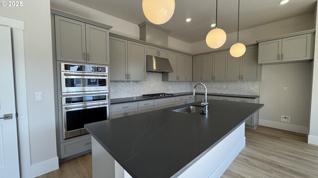 11699 SW 178th Dr, Beaverton, OR 97007 - kitchen with dishwasher, dark countertops, dark wood-style floors, recessed lighting, and backsplash