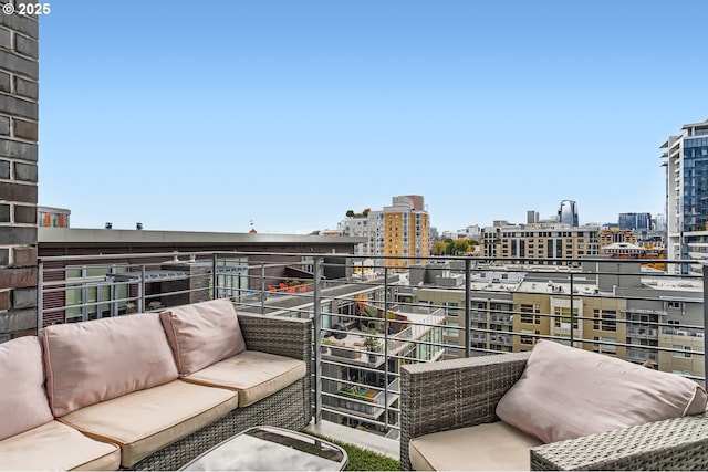 1255 NW 9th Ave Unit 806, Portland, OR 97209 - balcony featuring a view of city and outdoor lounge area