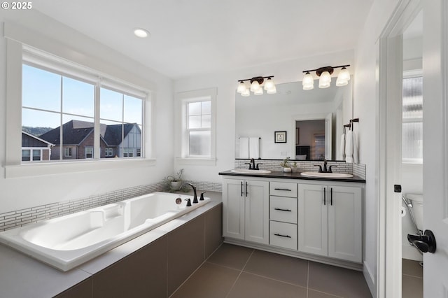 14878 NW Olive St, Portland, OR 97229 - bathroom featuring double vanity, tile patterned floors, a sink, and a garden tub