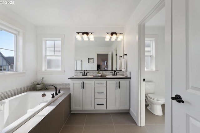 14878 NW Olive St, Portland, OR 97229 - bathroom featuring a sink, tile patterned flooring, toilet, and a bath
