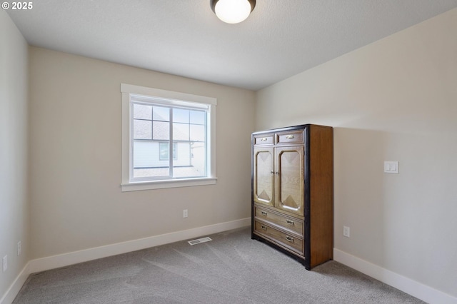 14878 NW Olive St, Portland, OR 97229 - unfurnished bedroom featuring visible vents, carpet, and baseboards