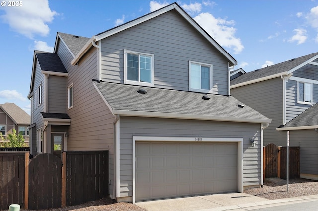 14878 NW Olive St, Portland, OR 97229 - view of front of property with fence, an attached garage, a shingled roof, and driveway
