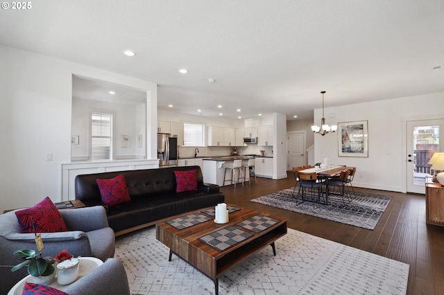 14878 NW Olive St, Portland, OR 97229 - living area with plenty of natural light, dark wood-style flooring, recessed lighting, and a chandelier