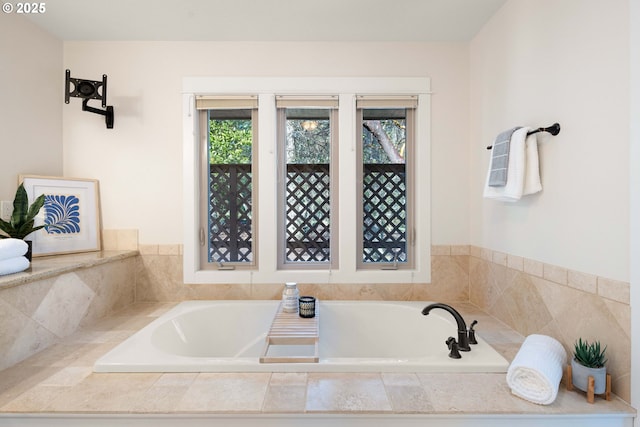 bathroom featuring tiled bath