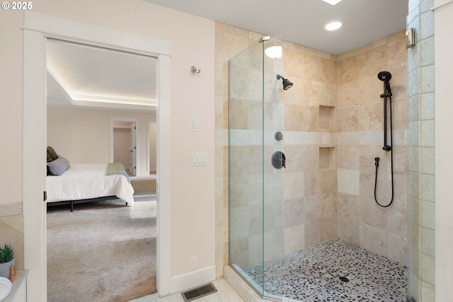 bathroom with a tile shower