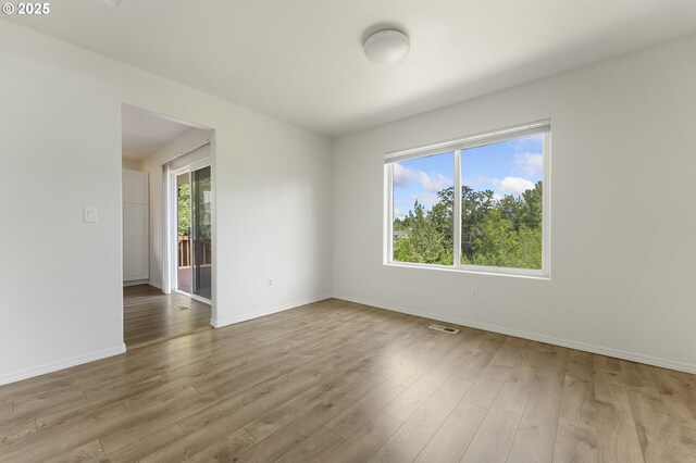 15629 NW Energia St, Portland, OR 97229 - empty room featuring wood finished floors and baseboards