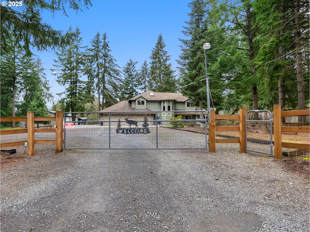 view of gate with a garage