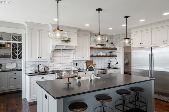 4040 Victor Point Rd NE, Silverton, OR 97381 - kitchen featuring built in fridge, dark countertops, open shelves, decorative backsplash, and stove
