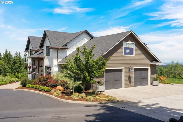 4040 Victor Point Rd NE, Silverton, OR 97381 - view of front of property featuring driveway, a shingled roof, and an attached garage