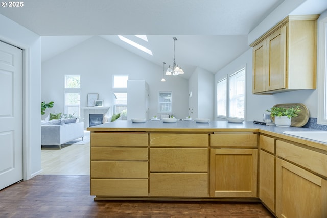 3618 Sterling Woods Dr, Eugene, OR 97408 - kitchen featuring light brown cabinets, a chandelier, a peninsula, light countertops, and dark wood-style flooring