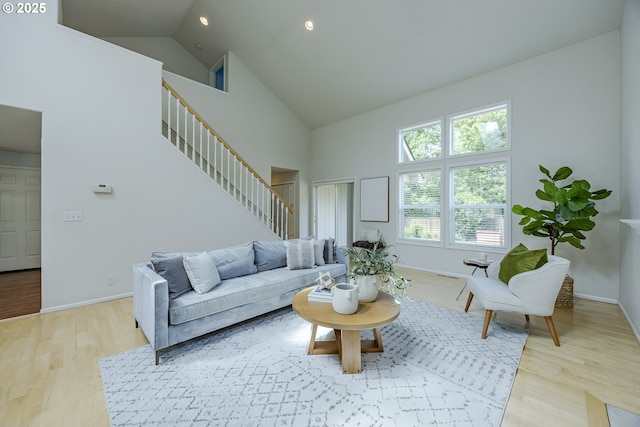 3618 Sterling Woods Dr, Eugene, OR 97408 - living room featuring high vaulted ceiling, stairs, wood finished floors, baseboards, and recessed lighting