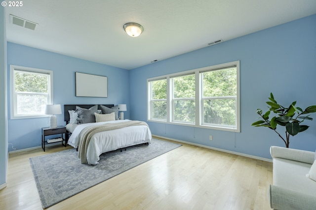 3618 Sterling Woods Dr, Eugene, OR 97408 - bedroom featuring multiple windows, baseboards, and wood finished floors