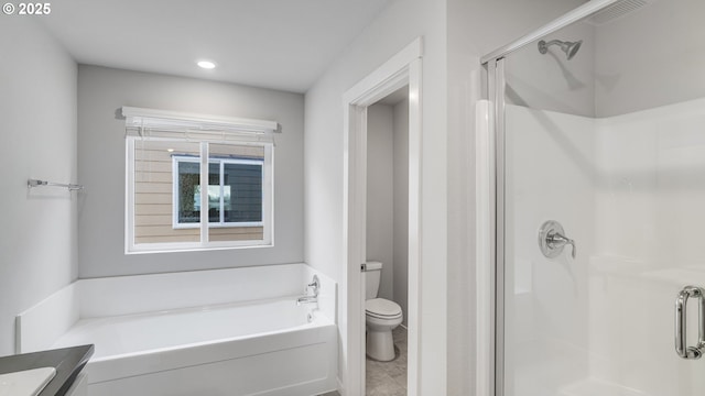full bath featuring toilet, a garden tub, recessed lighting, and a stall shower
