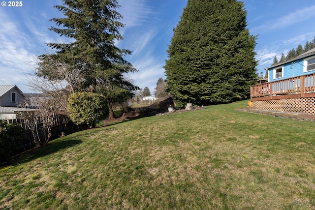 view of yard with a wooden deck