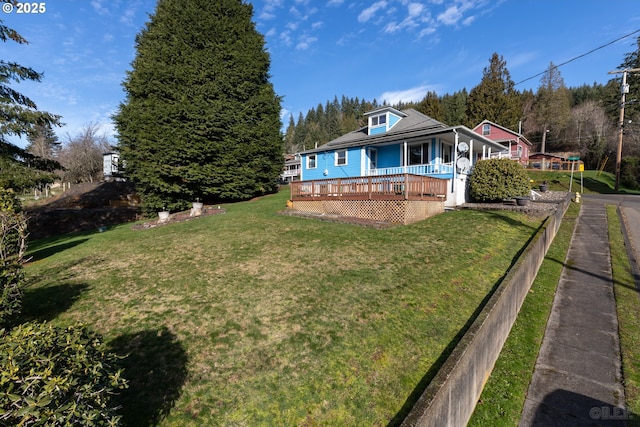 view of yard featuring a wooden deck