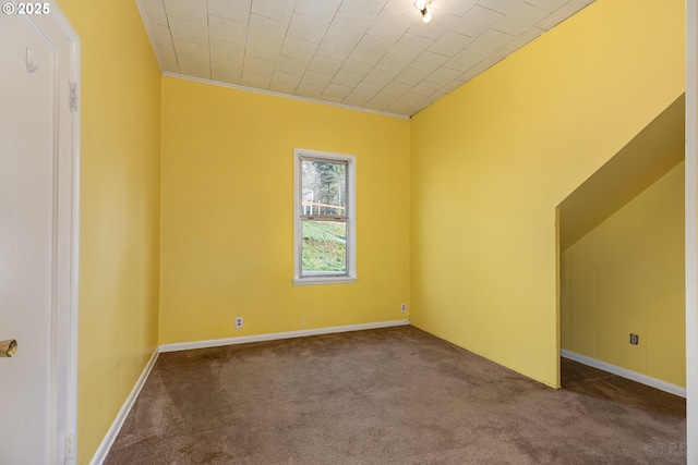 carpeted empty room featuring ornamental molding