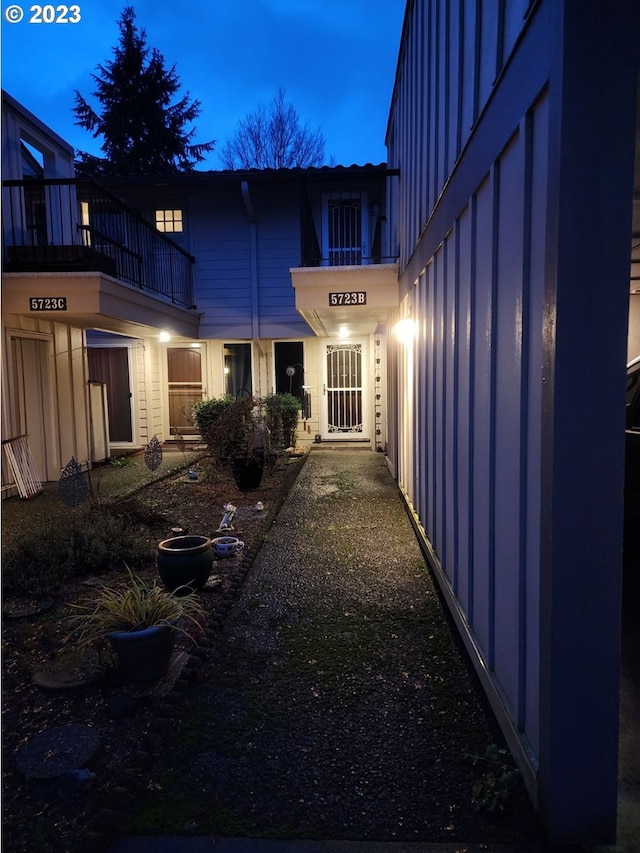5723 NE Hazel Dell Ave Unit B, Vancouver, WA 98663 - exterior entry at dusk featuring board and batten siding and a balcony
