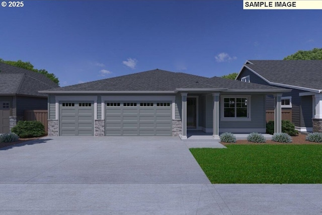 view of front of house with a garage and a front yard