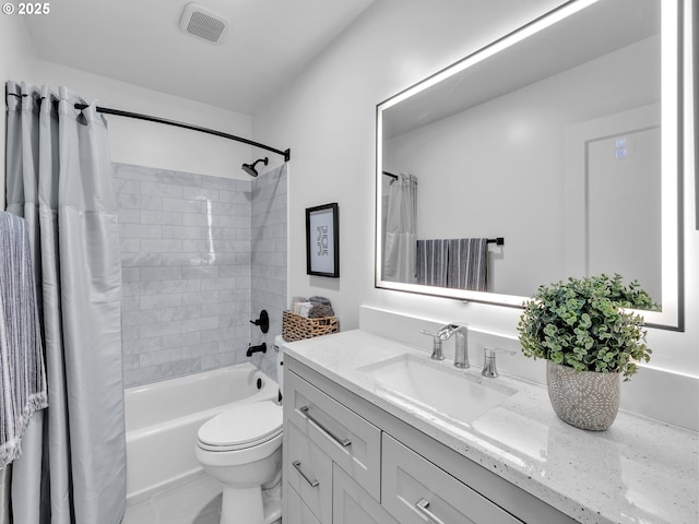 full bathroom with shower / tub combo with curtain, vanity, and toilet