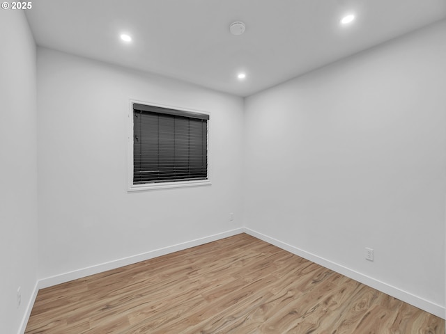 unfurnished room with light hardwood / wood-style flooring