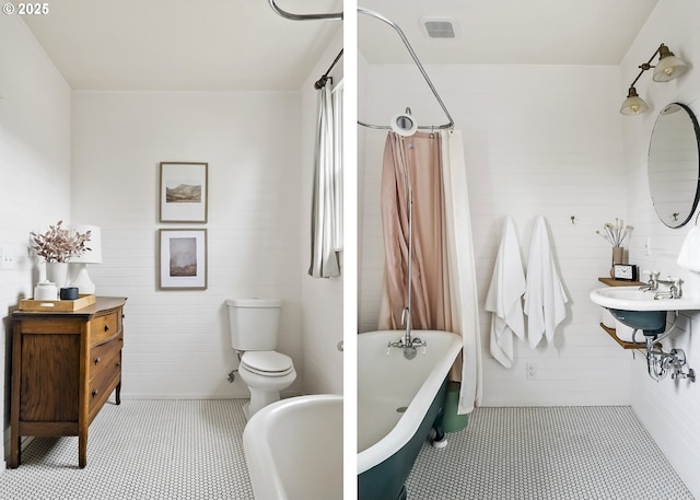 full bathroom featuring tile patterned floors, toilet, sink, and shower / bath combo with shower curtain