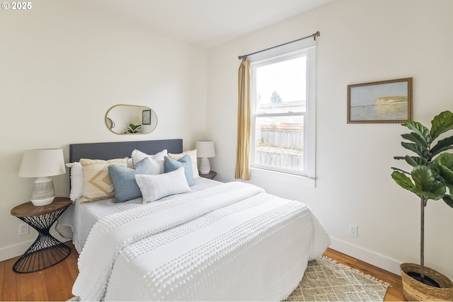 bedroom with hardwood / wood-style flooring