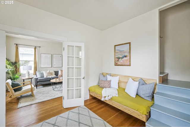 living area featuring hardwood / wood-style floors and french doors