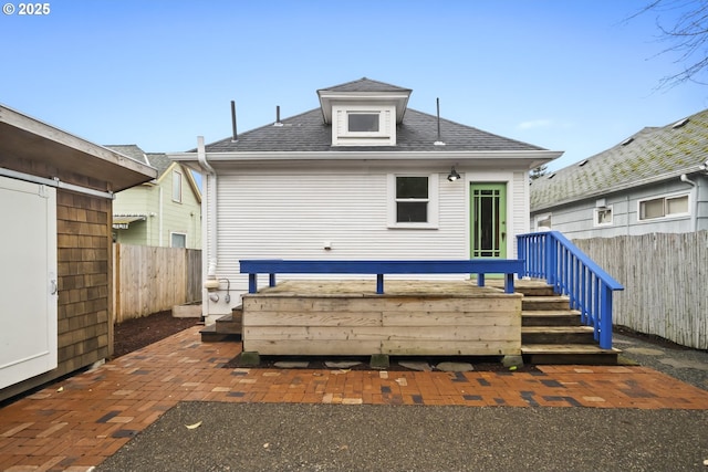 back of house with a wooden deck