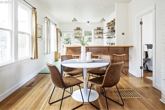 dining space featuring light hardwood / wood-style floors