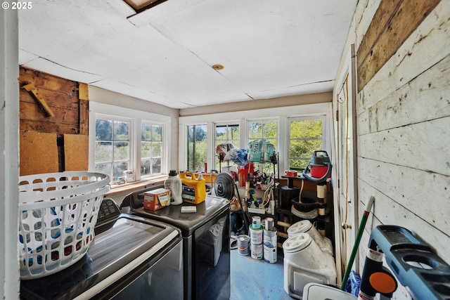 laundry room featuring washer and dryer and healthy amount of natural light