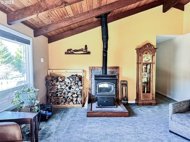 interior details featuring carpet, baseboards, a wood stove, wood ceiling, and beamed ceiling