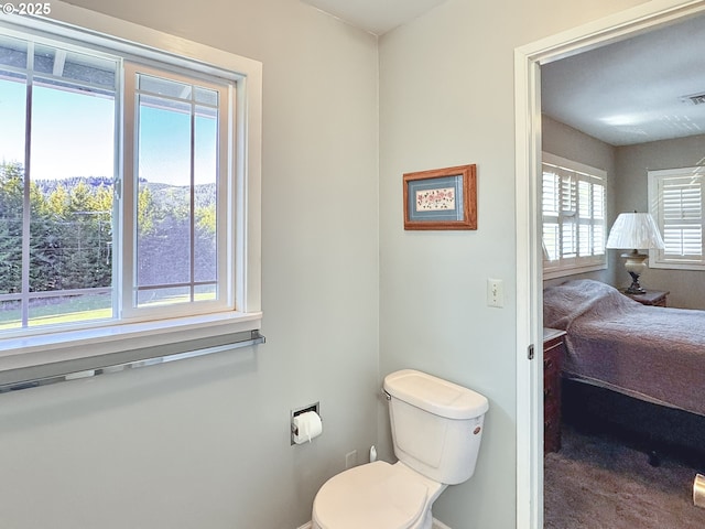 bathroom with visible vents and toilet