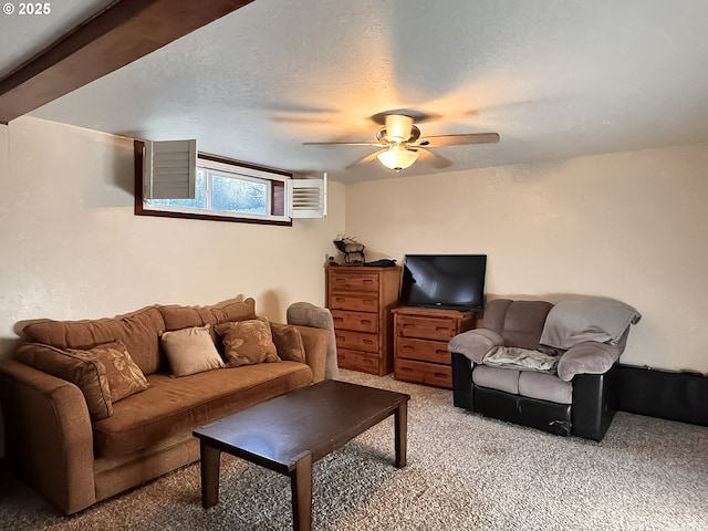 living room featuring a textured ceiling, a ceiling fan, a wall mounted air conditioner, and light carpet