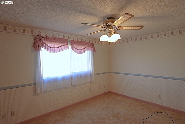 825 Seabreeze Ter, Coos Bay, OR 97420 - carpeted empty room with ceiling fan, wallpapered walls, and a textured ceiling